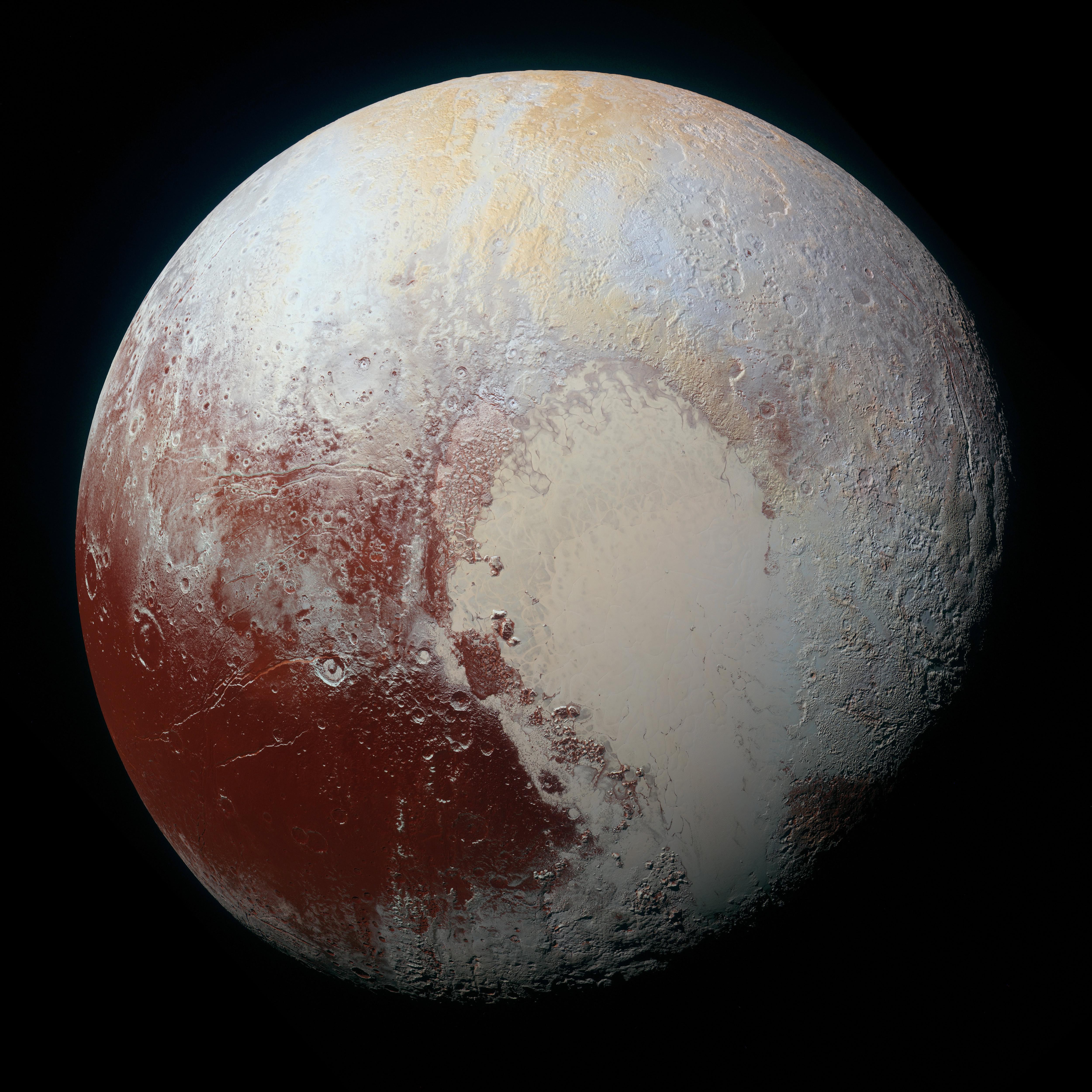 Image of Pluto in enhanced colour to bring out differences in surface composition. They include craters, ridges and plains.