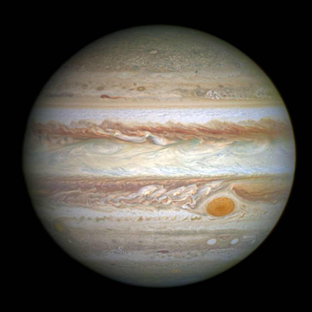 The planet Jupiter with horizontal cloud ribbons and the great red spot