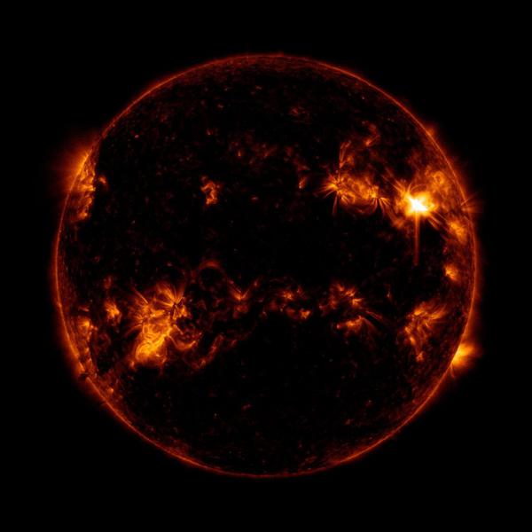 The Sun in ultraviolet appears as a circle. The flare is a bright patch in the upper right 3/4 of the way from the center
