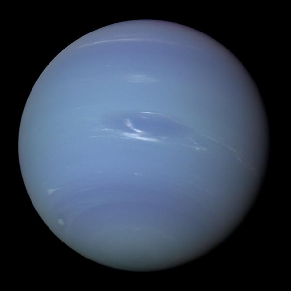 Neptune is spherical and blue with thin bands of white cloud and a slightly darker spot just below its equator