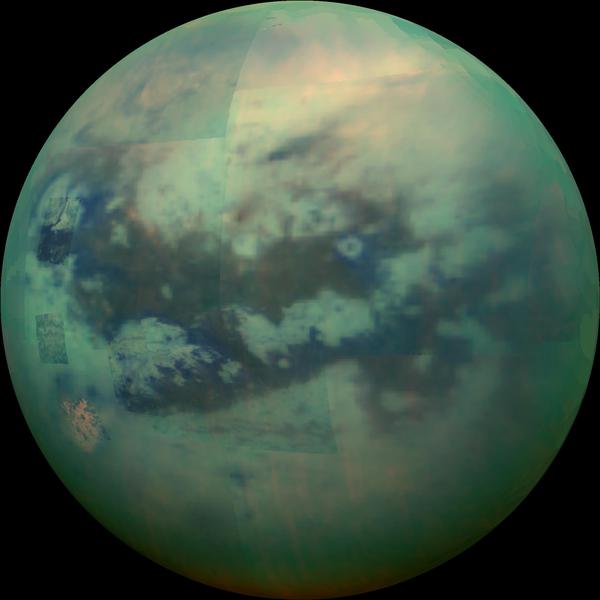 Titan is round and this false colour image shows its surface as green with a large H-shaped dark patch