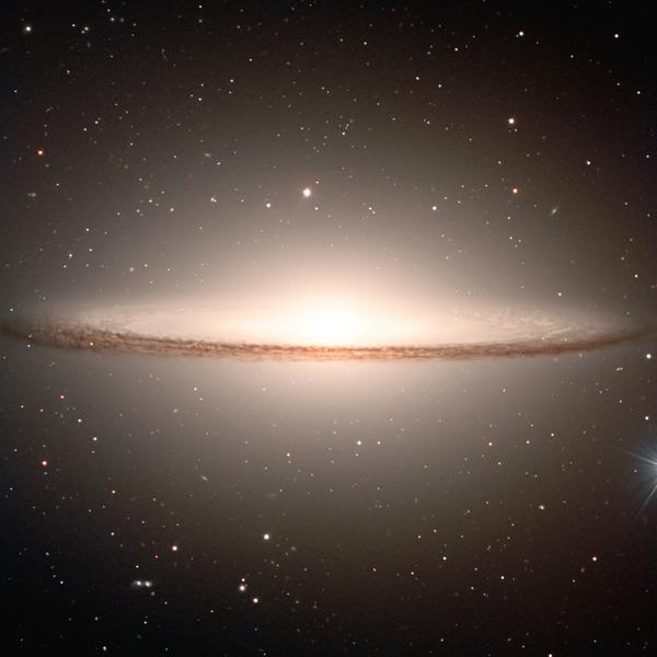 This galaxy has a large bulge surrounded by a ring of dust creating an image similar to the mexican hat with the same name