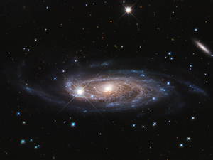 Hubble image of the spiral galaxy UGC 2885 showing a very large disk with faint spiral arms extending far from the center.